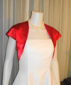   COLORED BOLERO JACKETS AS WELL AS MANY DIFFERENT STOLES, WRAPS, SCARFS