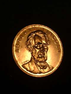 Abraham Lincoln coin. 1 in diameter. Silver in color. From the Shells 