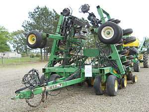   1850 30 no till air drill & 1900 195 bushel tow behind cart  