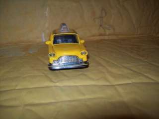   40 SCALE NEW YORK YELLOW CHECKER CAB FRICTION CAR 2 DOORS OPEN  