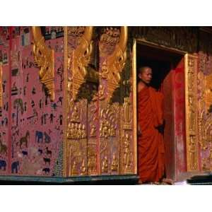 Buddhist Monk Standing in Doorway of Wat Xieng Thong, Luang Prabang 