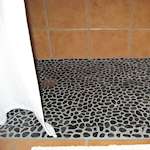 Polished Black Pebble Tile Shower Floor