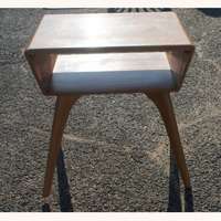   1955 features champagne finish two tier table splayedtapered legs a